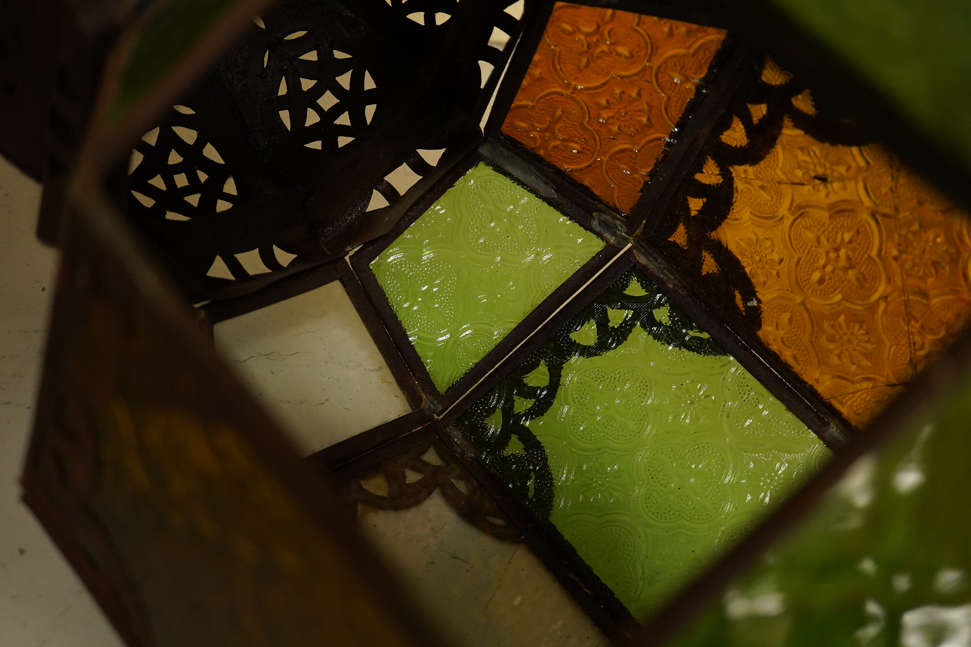 A Moorish coloured glass and tinplate lantern, 50cm high. Condition - poor